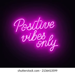 Positive Vibes Only neon lettering on dark background.