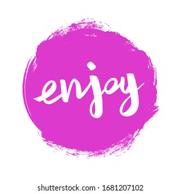 Positive word Enjoy on the pink spot. Inspirational handwritten card. Hand-drawn brush lettering. Vector calligraphy for your design, t-shirts, textiles, posters, prints, and web. 