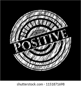 Positive written on a blackboard