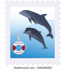 Postage stamp - Dolphins and a life preserver - isolated on white background  