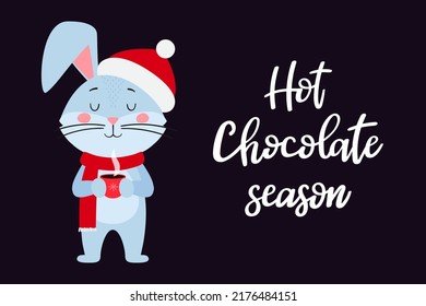 A postcard template with a cute rabbit, the symbol of the year 2023 in the Chinese calendar. Handwritten text "Hot chocolate season". Vector stock illustration.