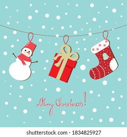 A postcard that depicts Christmas decorations in the form of a sock, a snowman, and a gift box hanging on a rope. Vector illustration.