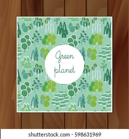 Postcard from trees "Green Planet" .The wooden background