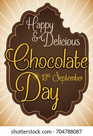 Poster with delicious chocolate bitten label with golden greeting sign to celebrate Chocolate Day in September 13.