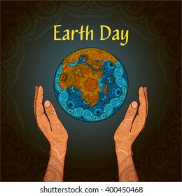 The poster to the Earth Day . Planet in the hands of man. The composition is decorated with ethnic ornaments .