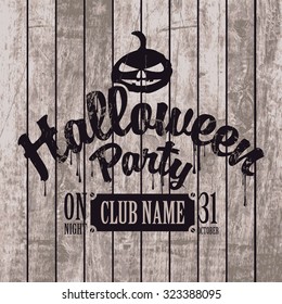 poster for halloween party on the background of wooden boards