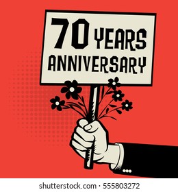 Poster in hand, business concept with text 70 years anniversary, vector illustration.