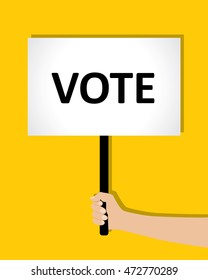 poster in hand that says "vote"