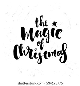 poster with a handwritten inscription. Brush Calligraphy "the magic of christmas" 