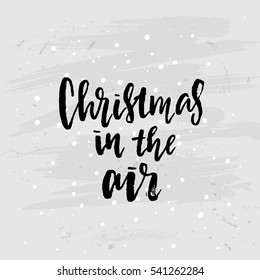 poster with a handwritten inscription. Brush Calligraphy "christmas in the air"