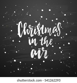 poster with a handwritten inscription. Brush Calligraphy "christmas in the air"