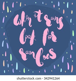 Poster with handwritten motivational inspirational phrase When It Rains Look For Rainbows. Hand drawn pink lettering in a form of circle on a blue background with colorful pastel raindrops