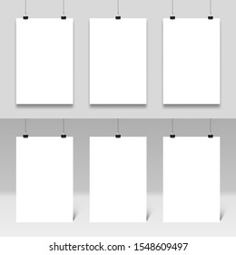 Poster mockup hanging on paperclips. Realistic posters frames template vector set. White paper boards with binders. Stationery accessories, office items. Empty placards and secretary devices