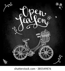 poster on the blackboard "open season" with bike, inscription