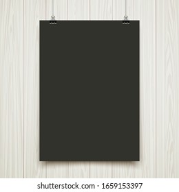 poster on wooden wall, white and black.