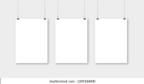 Poster template of a paper sheet. Hanging posters Set.