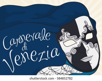 Poster with traditional male black and white volto mask, blue cape and jabot ready to wear in the masquerade night in Carnival of Venice (written in Italian) celebration.