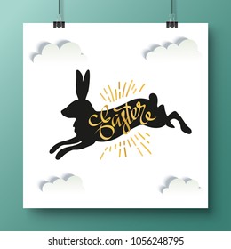 Poster with unique handwritten lettering Happy Easter and black bunny on a white background with clouds.