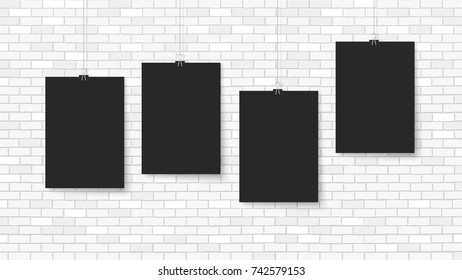 Posters on binder clips. Paper templates on brick wall. Realistic mock up. Empty notepad sheet for your business design. Brick wall. Vector templates for lettering, quote, images or logos.