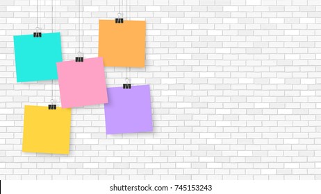 Posters on binder clips. Paper templates on brick wall. Realistic mock up. Empty notepad sheet for your business design. Brick wall. Vector templates for lettering, quote, images or logos.