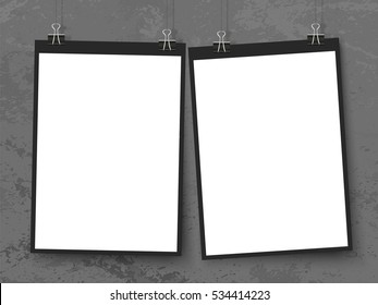 Posters on binder clips on the wall. Rectangular black paper mock ups set. Modern trendy vertical framing for your design. Vector template for picture, drawing, quotes poster or photo.