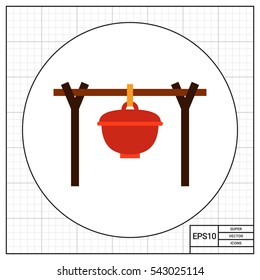 Pot handing above bonfire