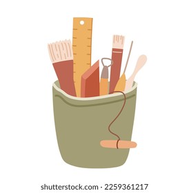 Pottery tools organized in a pot. Set of clay handcraft instuments