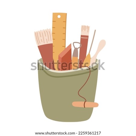 Pottery tools organized in a pot. Set of clay handcraft instuments
