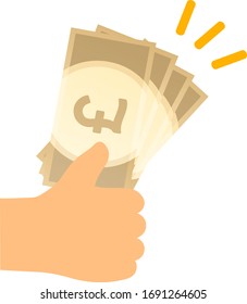 Pound banknotes held in hand.