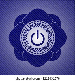 power icon inside badge with denim texture