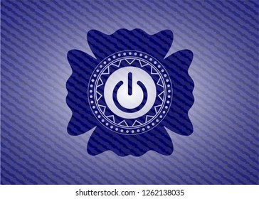 power icon inside badge with denim texture