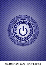power icon inside badge with denim background