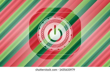 power icon inside christmas colors style badge.