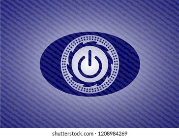 power icon inside denim background