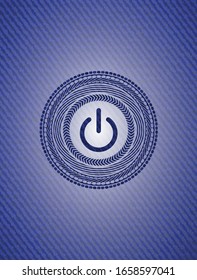 power icon inside emblem with jean background