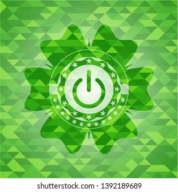 power icon inside green emblem with triangle mosaic background