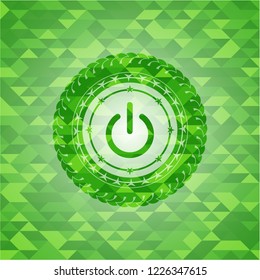 power icon inside green mosaic emblem