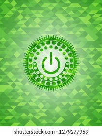 power icon inside green mosaic emblem