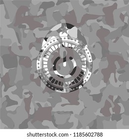 power icon inside grey camo emblem