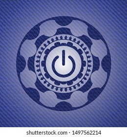 power icon inside jean or denim emblem or badge background