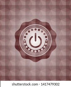 power icon inside red seamless emblem with geometric pattern.