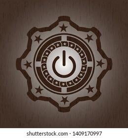 power icon inside retro wooden emblem