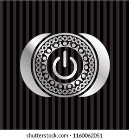 power icon inside silver badge or emblem