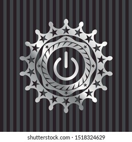 power icon inside silver badge or emblem
