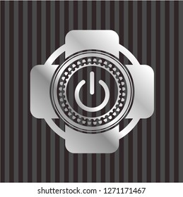 power icon inside silver emblem
