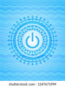 power icon inside sky blue water style emblem.