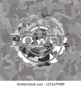 Power written on a grey camouflage texture