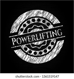 Powerlifting chalk emblem written on a blackboard