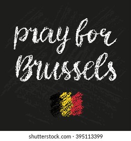 Pray for Brussels chalk lettering. Tribute to victims of terrorism in airport.