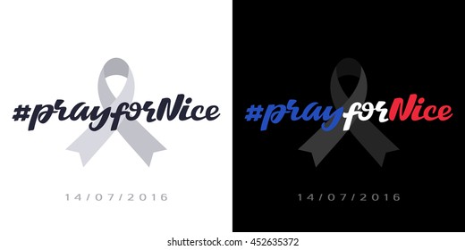 # Pray for Nice hash tag phrase on a mourning ribbon. Terror attack in the Nice, France, on 14/07/2016